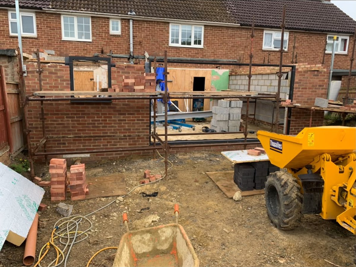 Brickwork underway on a rear extension with scaffolding up
